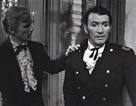 south-1959-002-peter-wyngarde-medium-shot-held-on-elbow-by-graydon-gould